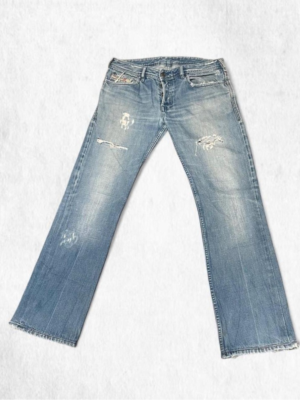 Diesel vintage ZATHAN light blue denim bootcut jeans with distressing
